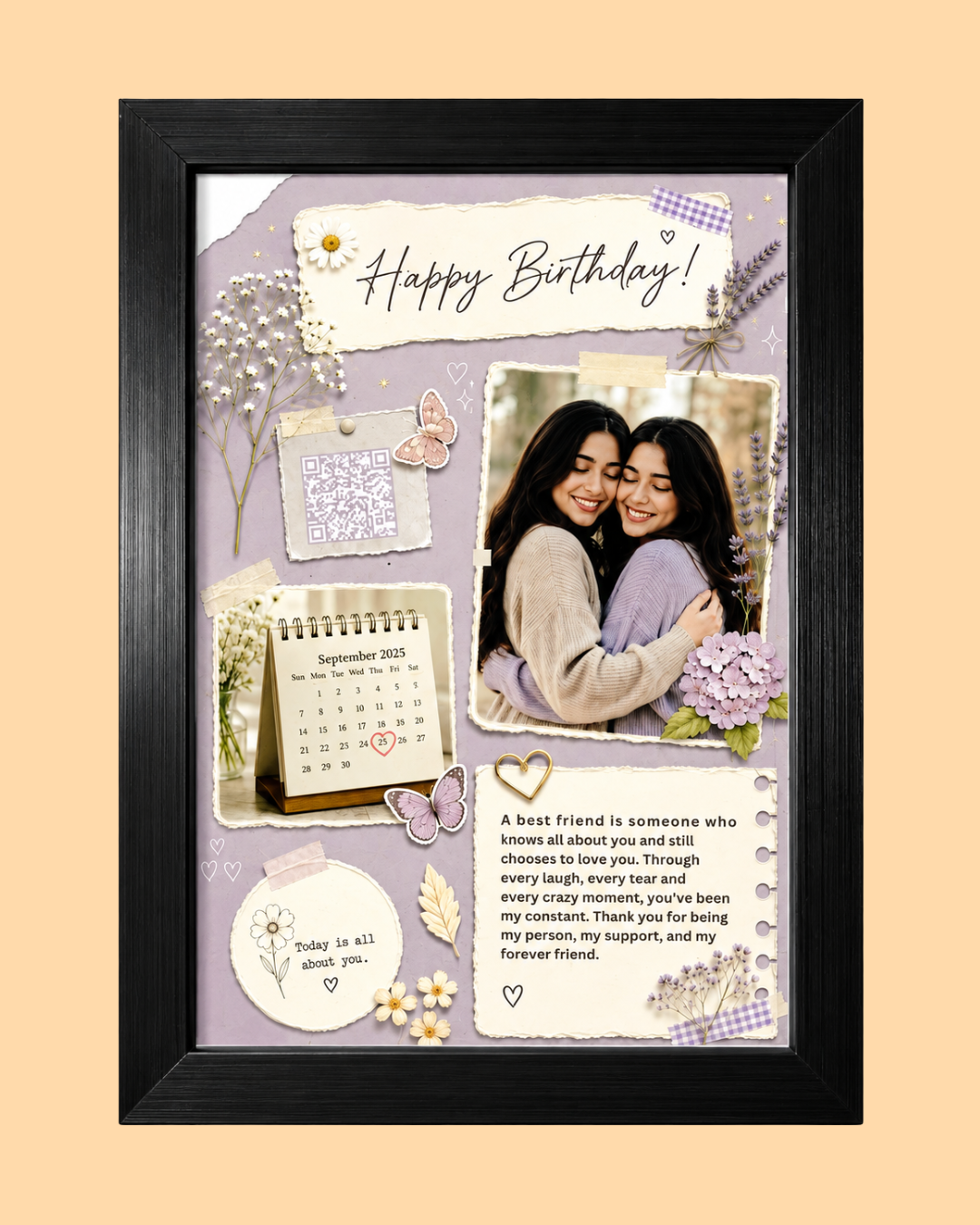 A framed personalized birthday collage with a black frame, featuring a lavender background, decorative paper cutouts, butterflies, flowers, a small calendar, and a printed photo of two women. The collage includes the text 'Happy Birthday!' and a heartfelt message, set against a solid pale peach background.